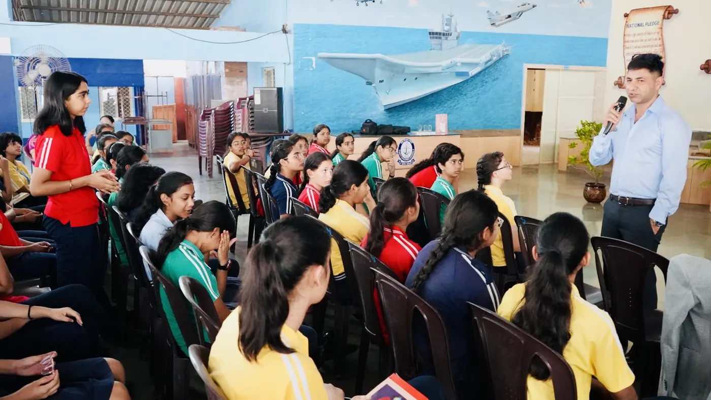 Students attending aviation guidance session at NCS Goa with INS Vikramaditya mural